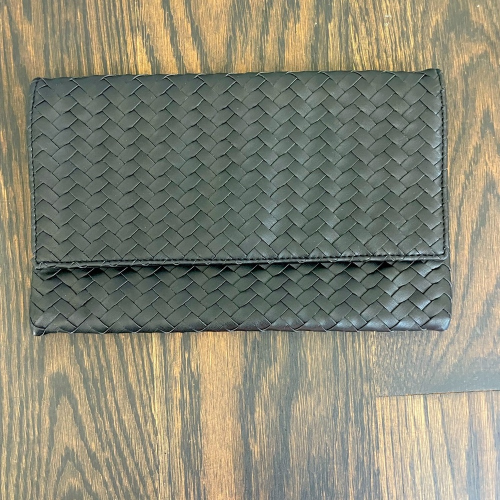 Black Woven Clutch. Flat flap style with hidden magnet closure. NEW- Never used.